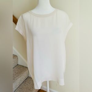 Theory cream, silk, cap sleeved blouse with invisible back zipper. Size large.